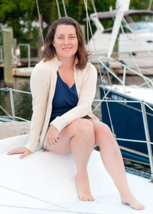 Kristin Rutkowski poses on a sailboat.