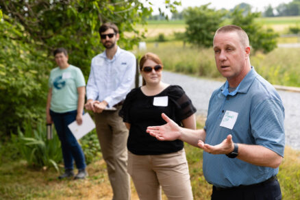 Lee McDonnell, chair of the Management Board, speaks among a small group at a Pennsylvania farm.