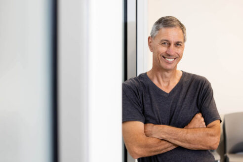 Headshot of Peter in an office.