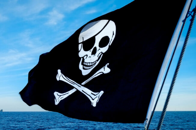 A black flag features a white skull and crossbones.