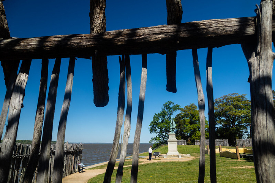 Wooden beams and poles form the shape of a fence