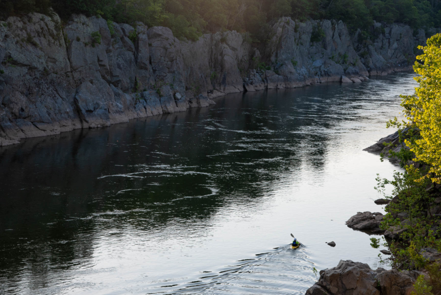 A kayaker paddles on the Potomac River in Great Falls Park.