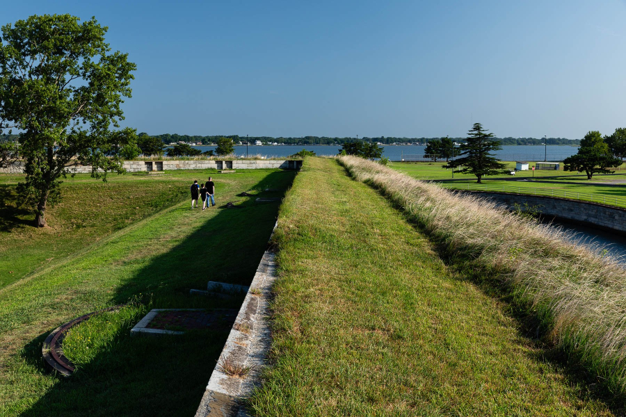 The outer walls of Fort Monroe stretch out toward a river on the horizon.