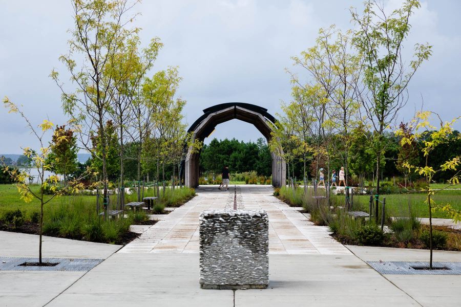 A walkway is seen leading to the entrance of Machicomoco State Park